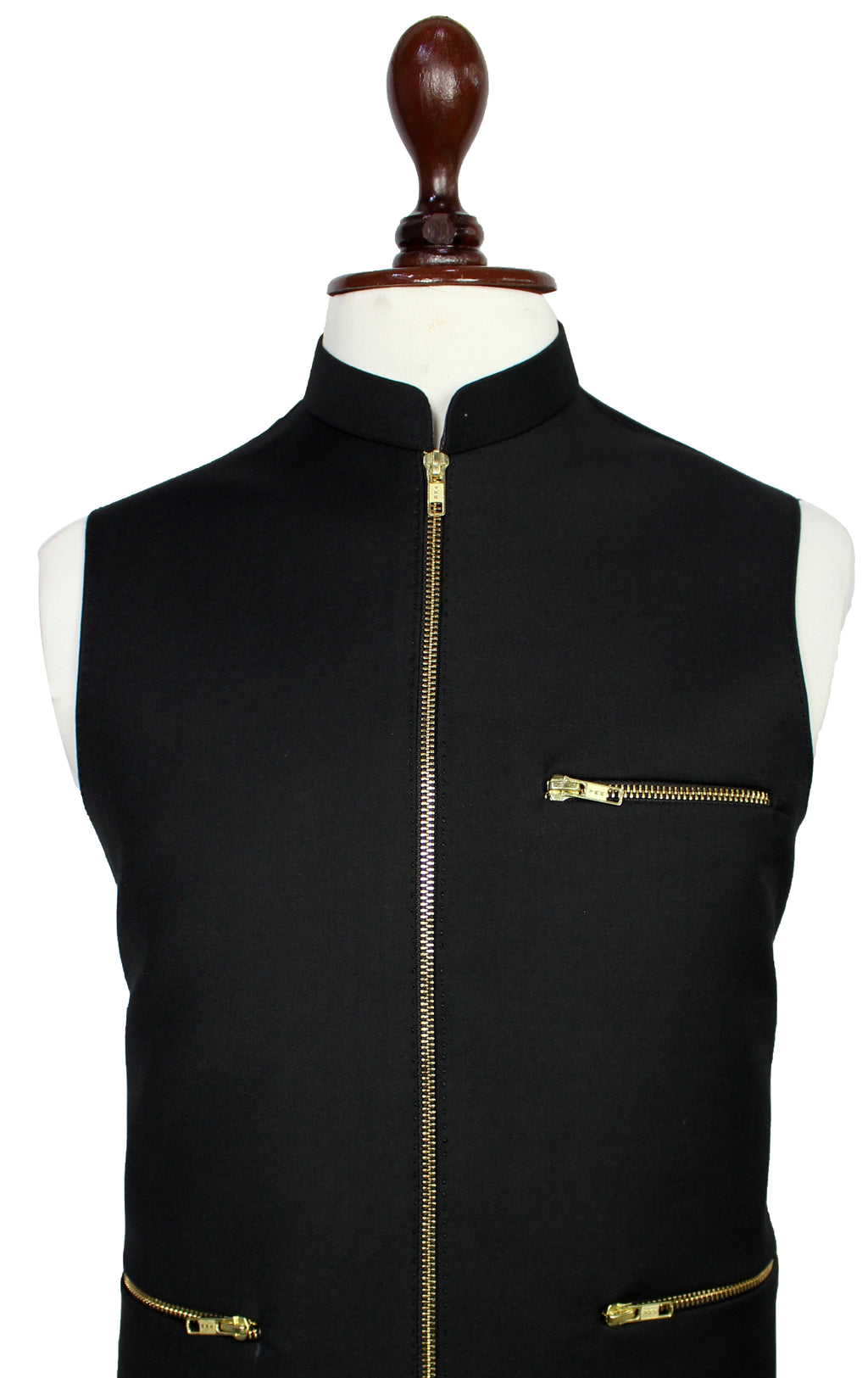 A black sleeveless vest with gold-tone zippers, displayed on a white mannequin torso with a dark wooden neck cap against a plain white background.