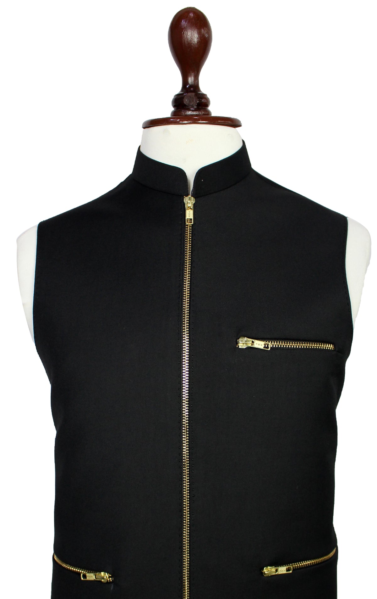 A black sleeveless vest with gold-tone zippers, displayed on a white mannequin torso with a dark wooden neck cap against a plain white background.