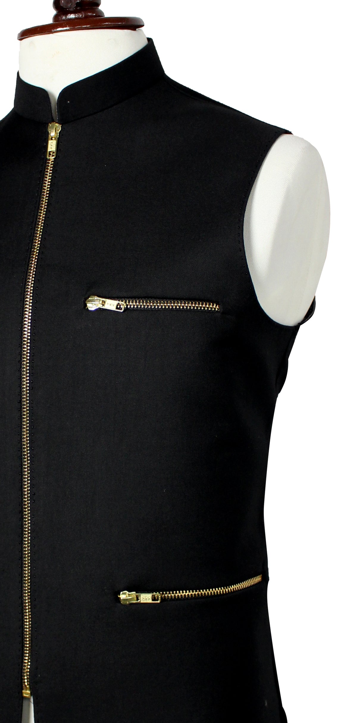 A black sleeveless vest with a mandarin collar and gold-tone zippers, displayed on a white mannequin torso against a white background.