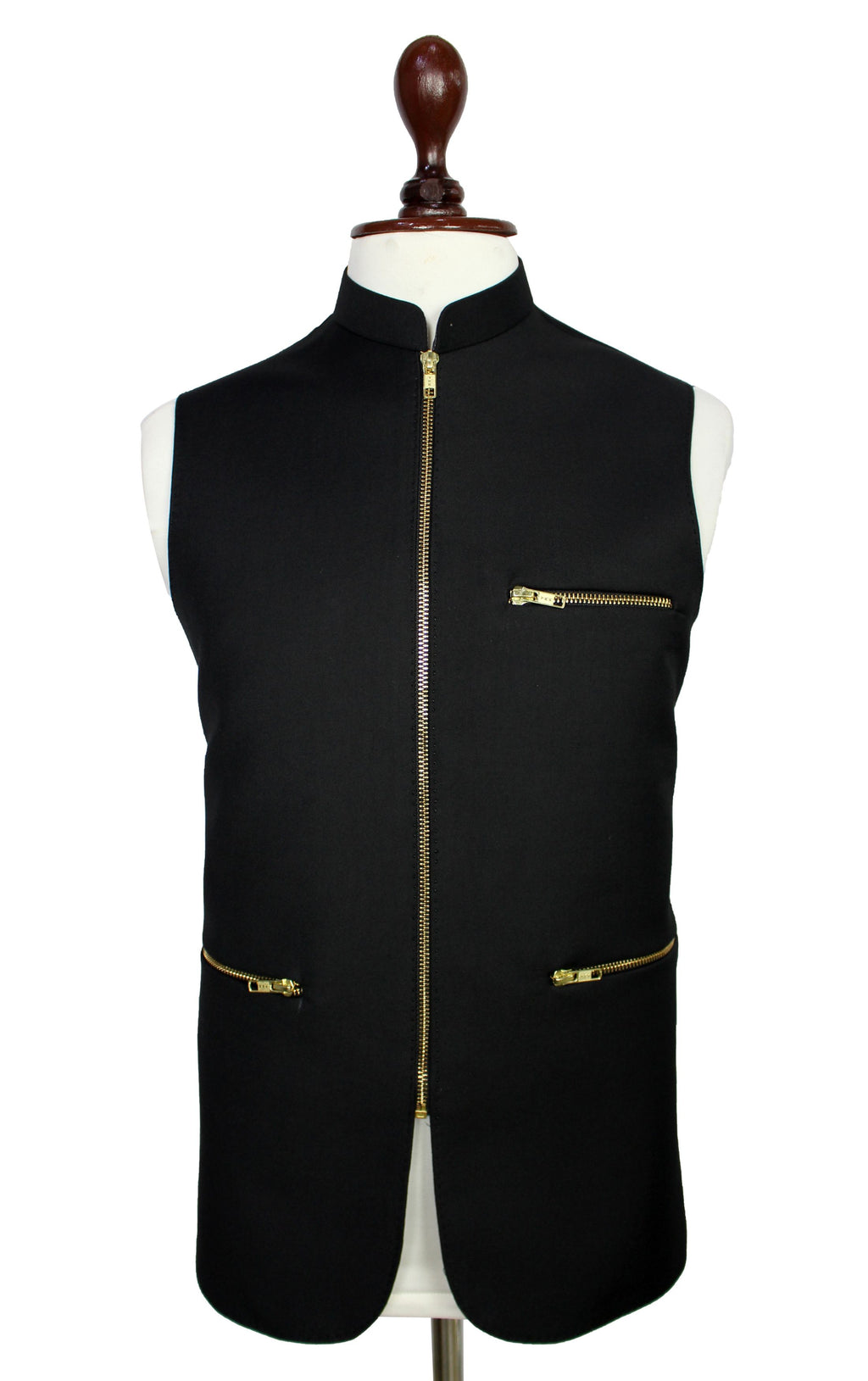 A black sleeveless waistcoat vest with gold zippers, displayed on a white mannequin torso with a wooden neck cap against a white background.