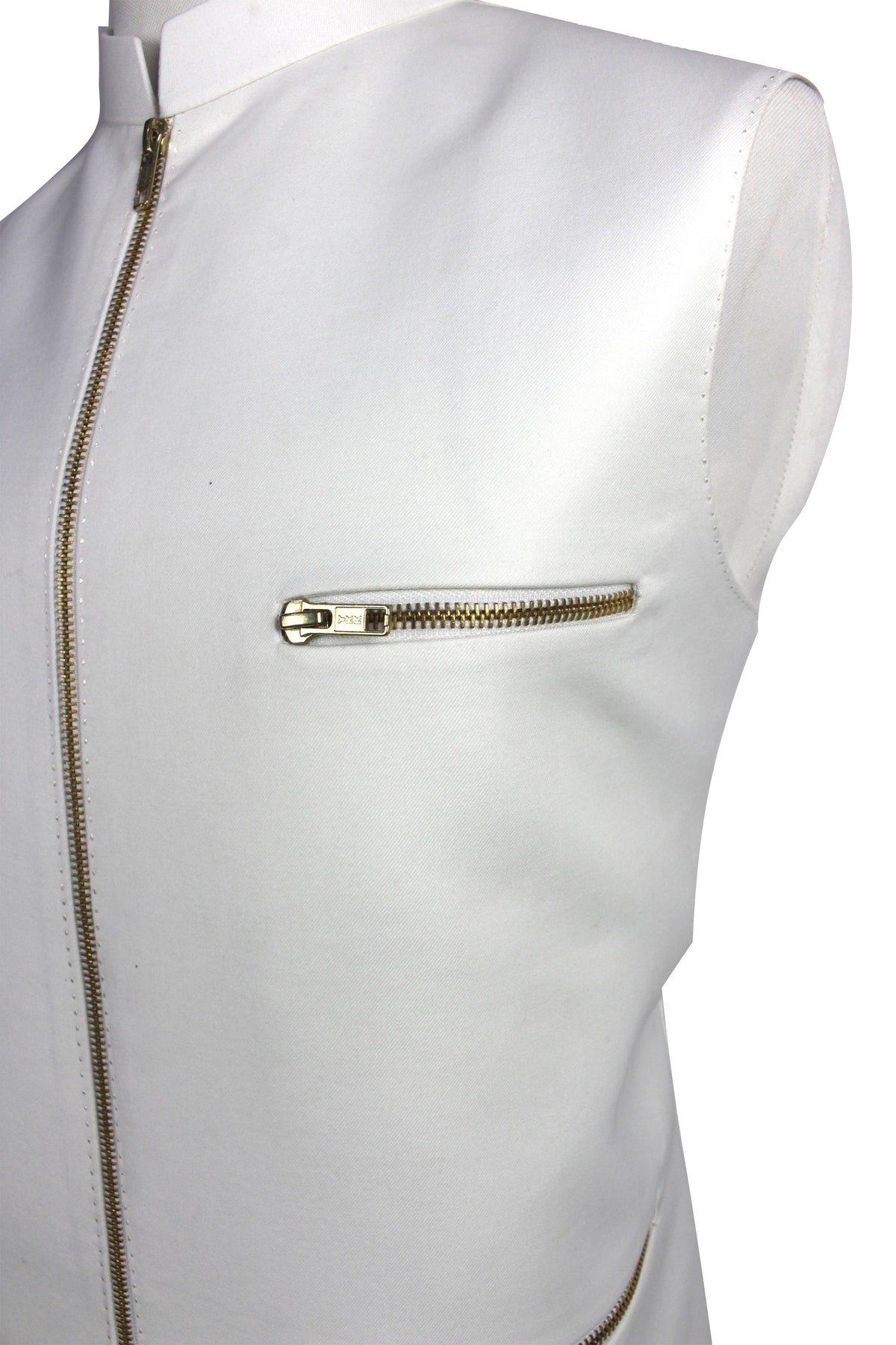 A close-up of a white sleeveless vest or jacket with gold-tone zippers, including a front zipper and a horizontal zip pocket on the chest.